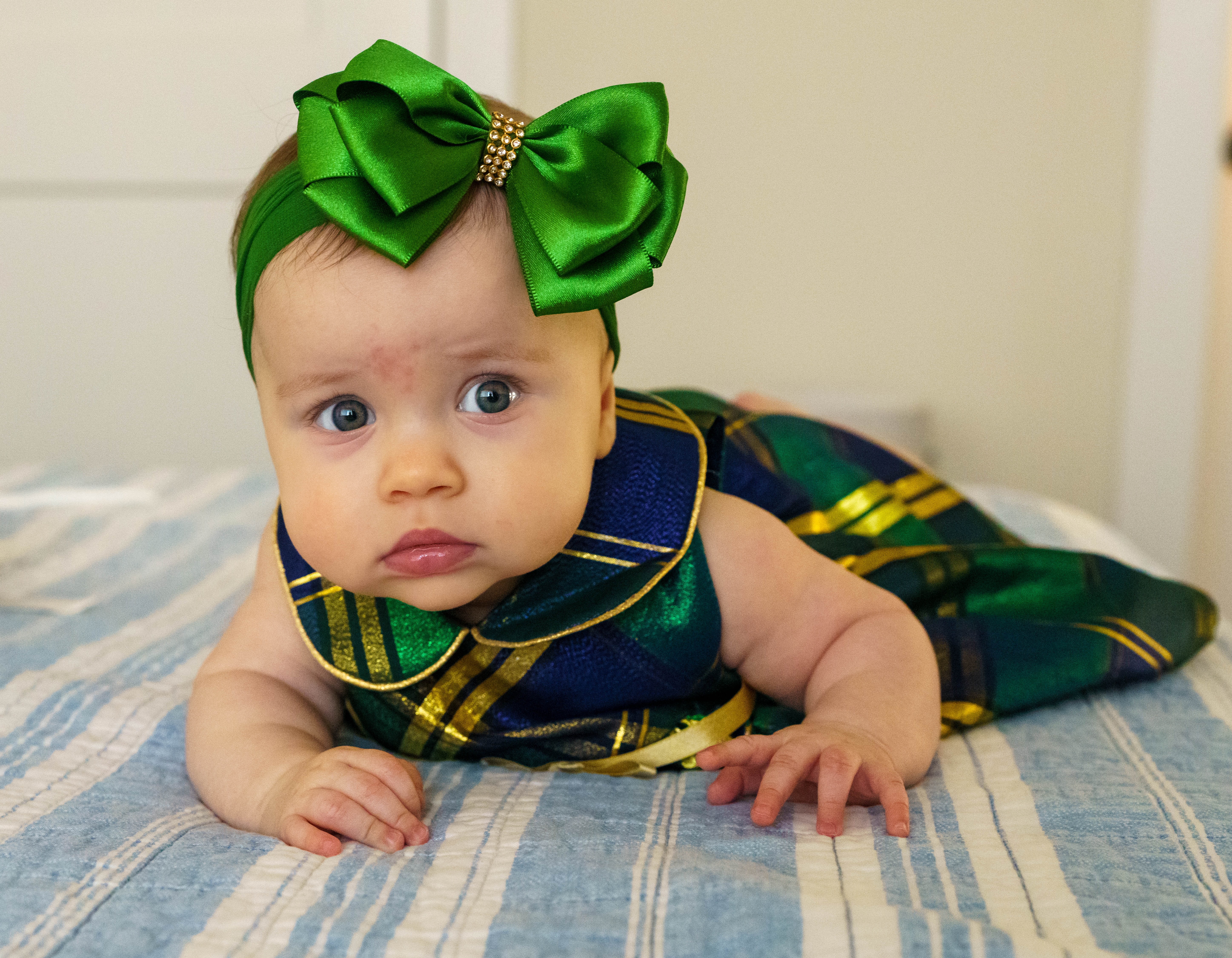 Isabella in green plaid dress with bow headband